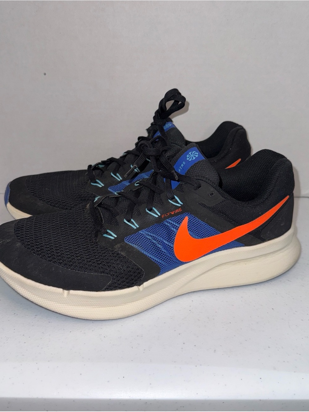 Nike Men's Black/Blue Running Shoes with Orange Swoosh fly wire size 10